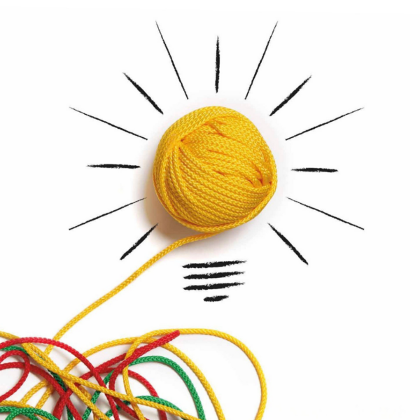 Aus einem verknoteten Wollhaufen entspinnt sich ein sauber aufgerolltes Wollknäuel, dass mit Pinselstrichen zu einer Glühbirne gezeichnet ist. Die Botschaft lautet "Mir geht ein Licht auf!"